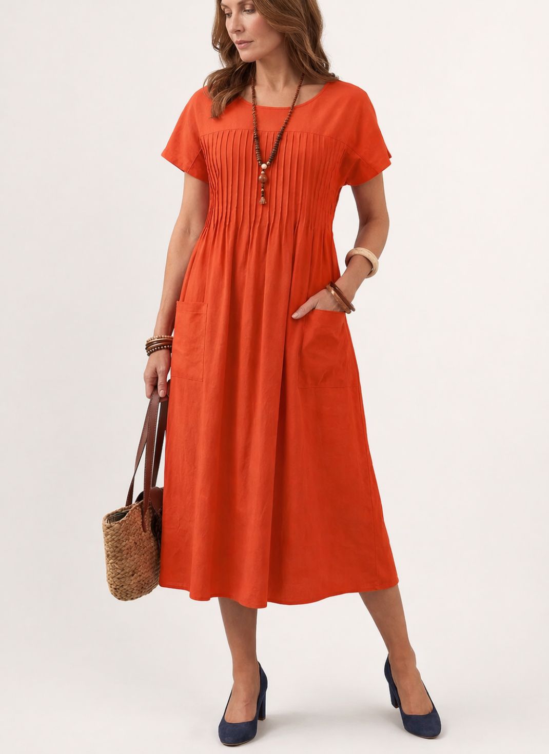 Vestido Midi Solto com Manga Curta e Bolsos Laterais